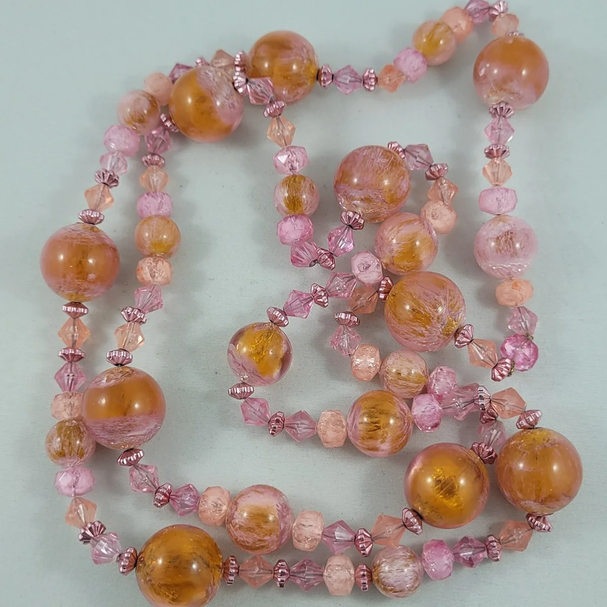 1950's - 1960's Moulded Pink Orange Marbled Lucite Plastic Round Bicone Bead Rope Necklace -1.jpg (Copy)