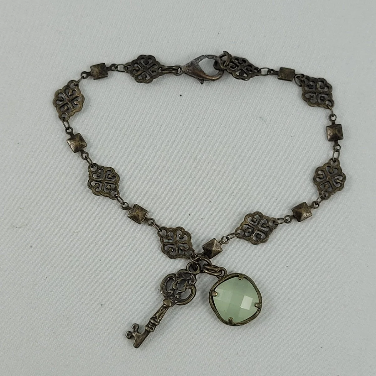 Victorian Style Scrolled Hearts Brass Panel 8 Inch Bracelet with Faceted Faux Gemstone Key Charms.jpg