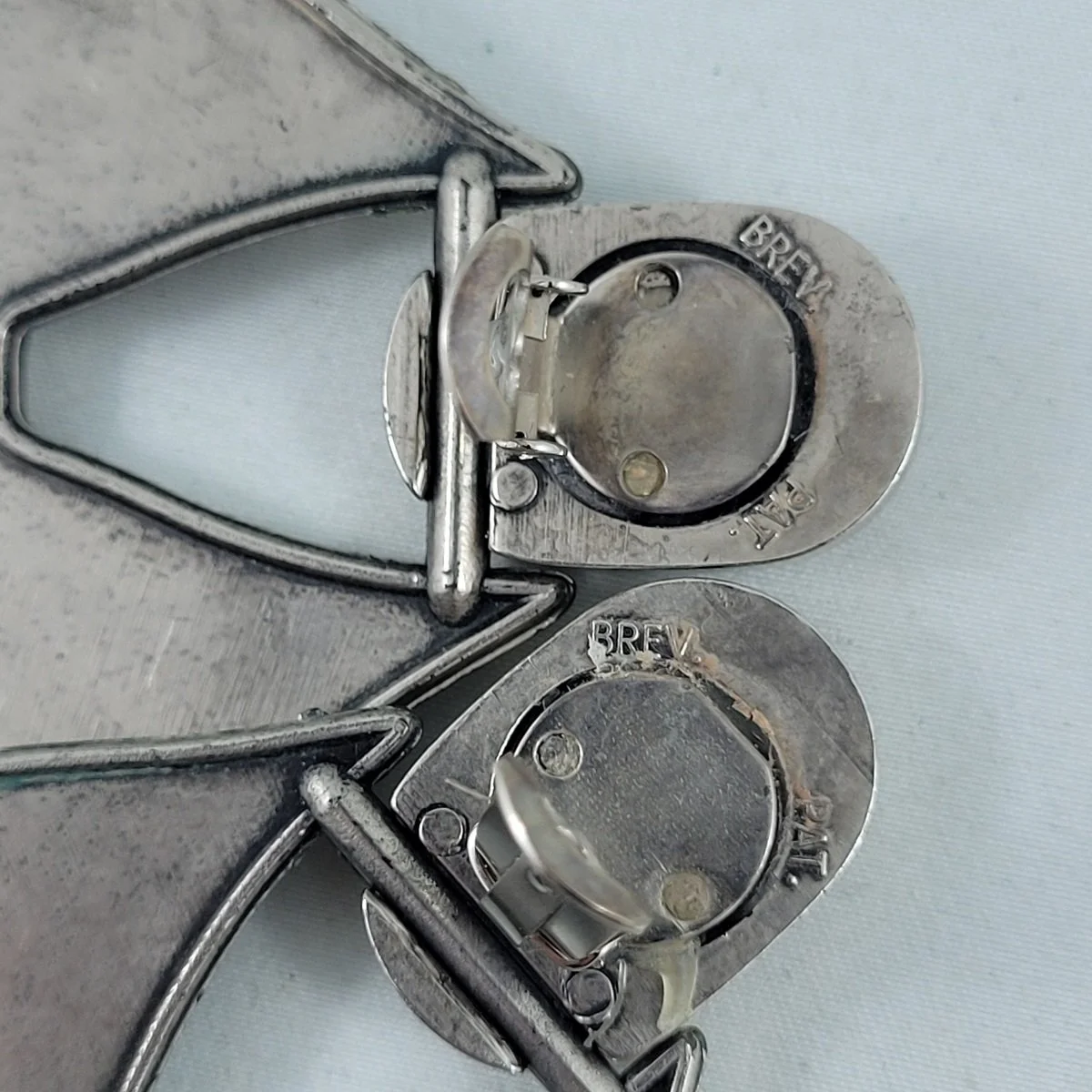 Italian Modernist Brev. Pat. Brushed Silver Plastic Ribbon Bow Door Knocker Clip-on Earrings -3.jpg