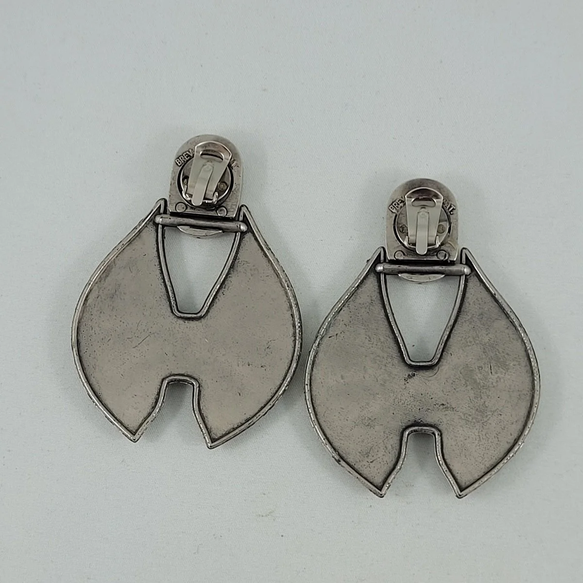 Italian Modernist Brev. Pat. Brushed Silver Plastic Ribbon Bow Door Knocker Clip-on Earrings -2.jpg