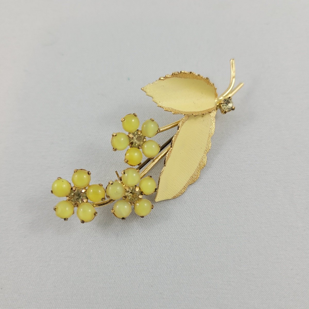Glowing Yellow Glass Bead Cabochon Prong Set Rhinestone Triple Stemmed Flower Brass Brooch Side View