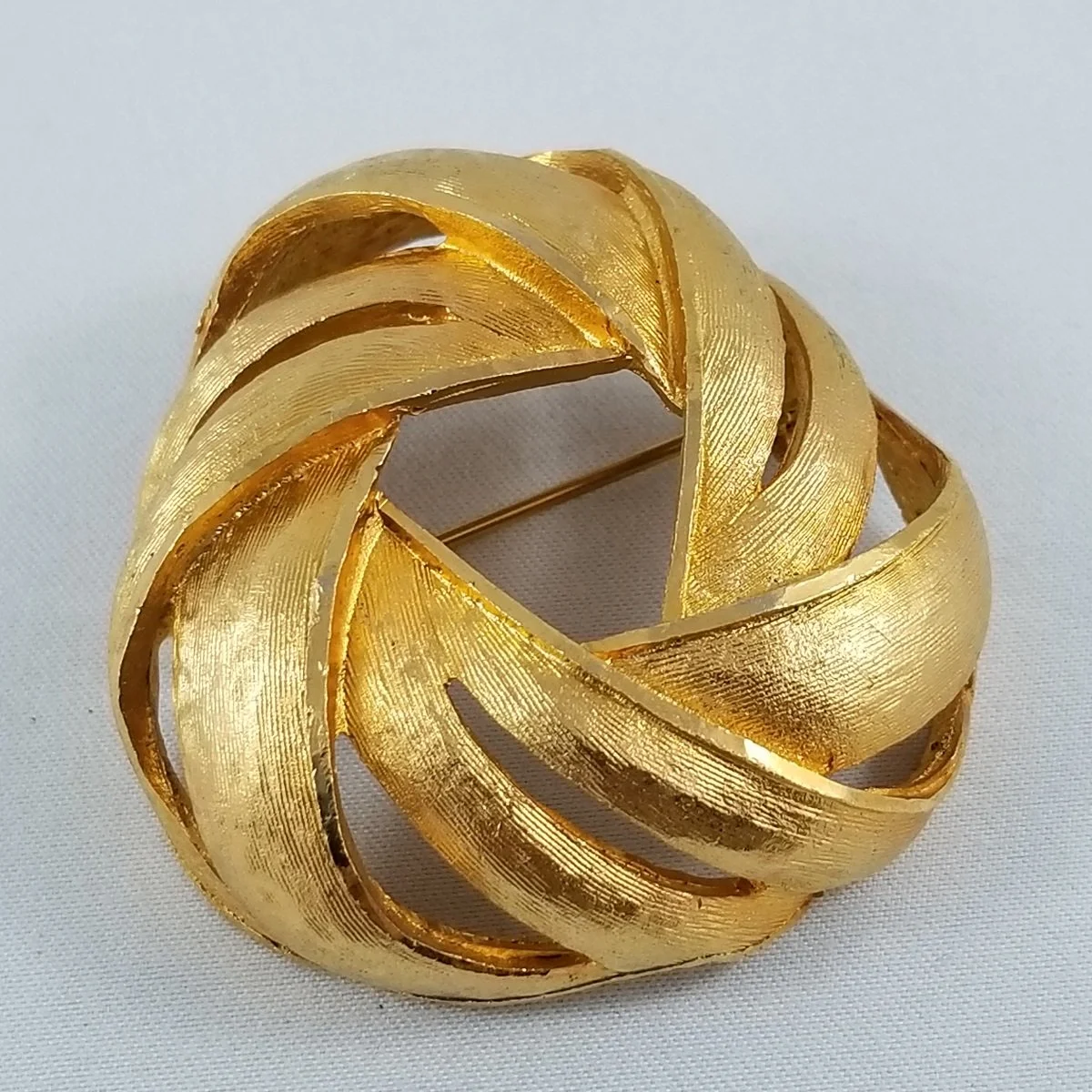 Coro Florentine Gilded Modernist Domed Pinwheel Brooch.jpg