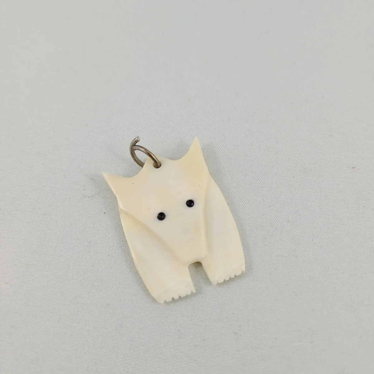 Indigenous Inuit Carved Bovine Forward Facing Polar Bear Animal Spirit Totem Pendant.jpg