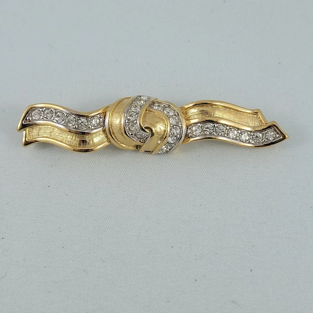 Nina Ricci Crystal Rhinestone Knotted Wavy Ribbon Gold Brooch Front View