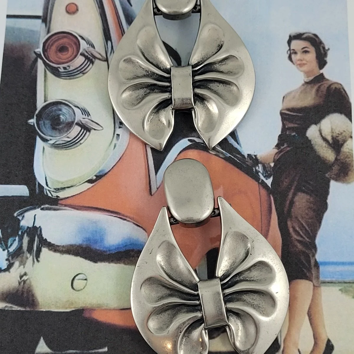 Italian Modernist Brev. Pat. Brushed Silver Plastic Ribbon Bow Door Knocker Clip-on Earrings.jpg