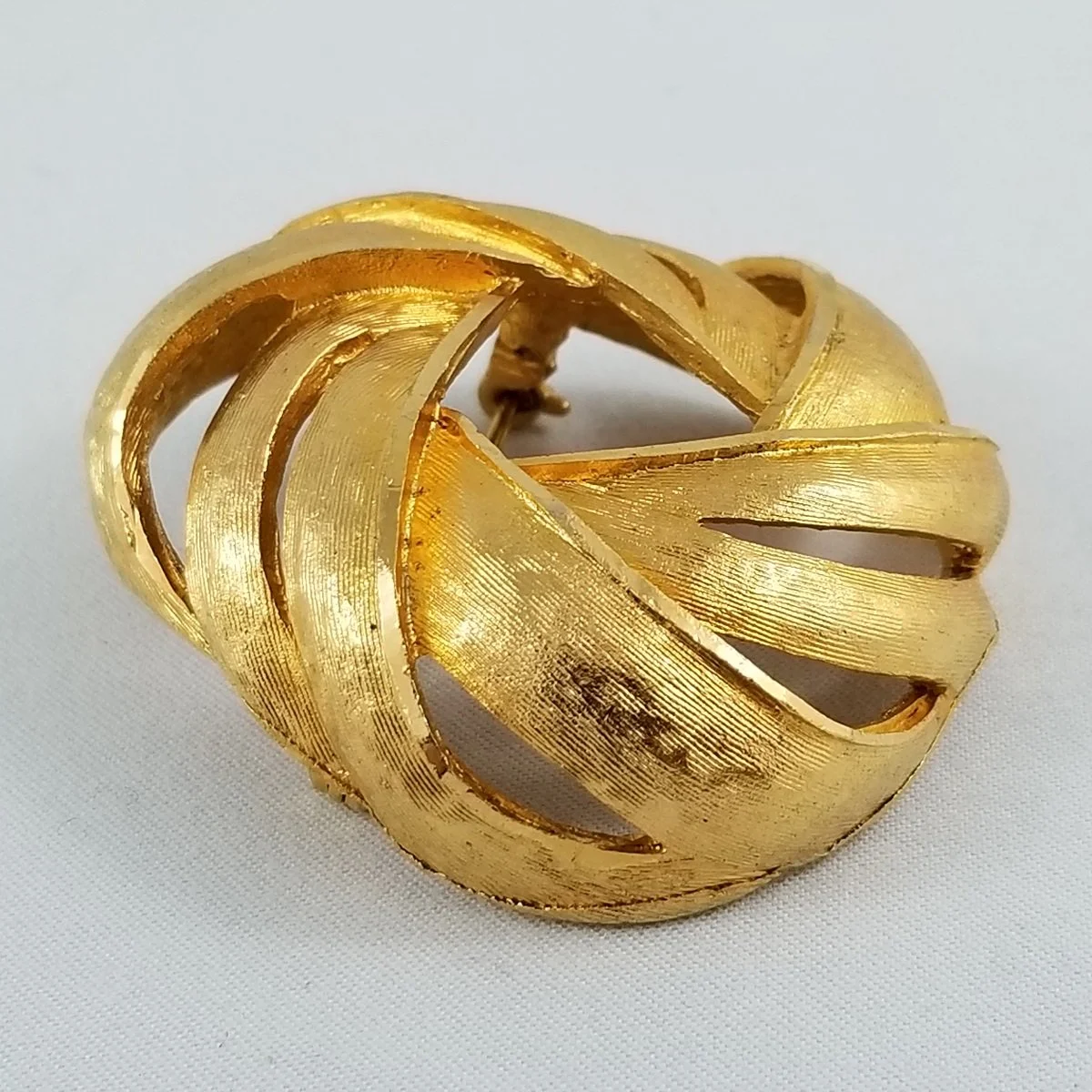 Coro 1940s—1954 Florentine Gilded Modernist Domed Pinwheel Brooch -1.jpg