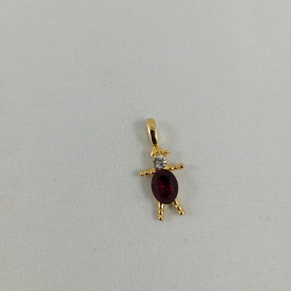 Red Gem Belly Faceted Clear Glass Chaton and Oval Rhinestone Gold-tone Figural Person 1 Inch Charm Pendant Front View