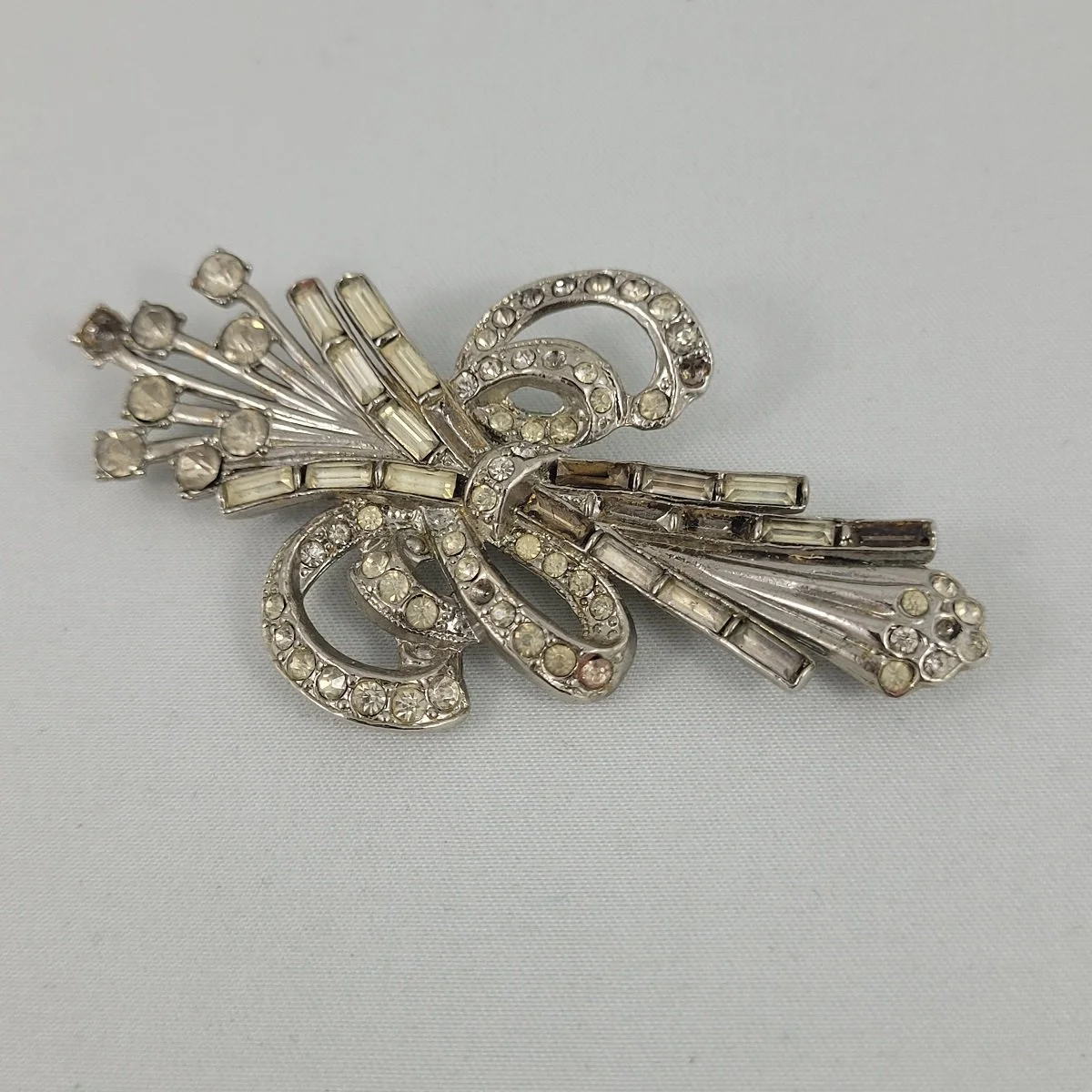 1940's Silvertone Clear Baguette Chaton Pave Rhinestone 2.875 Inch Floral Spray Brooch