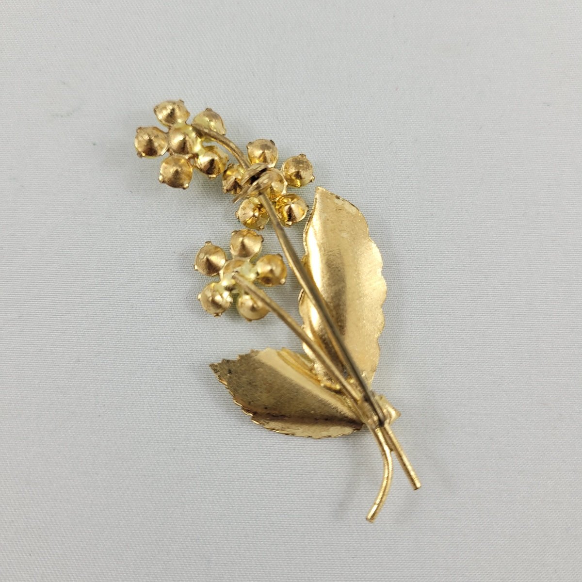 Glowing Yellow Glass Bead Cabochon Prong Set Rhinestone Triple Stemmed Flower Brass Brooch Backside