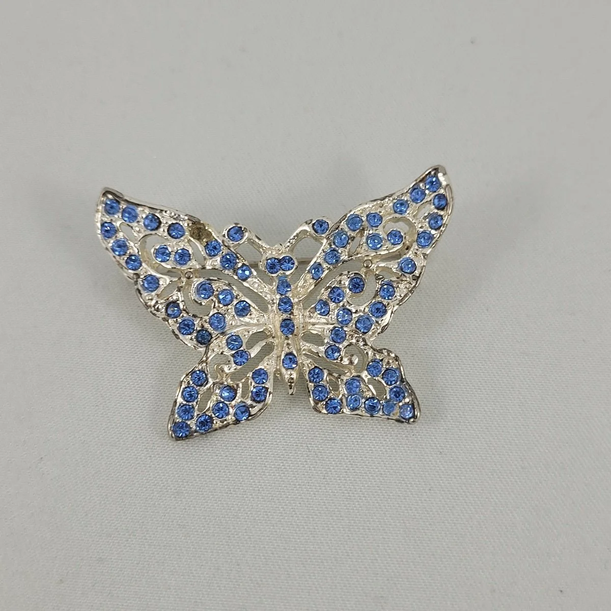 1930's Rhodium Plated Pot Metal Blue Pave Rhinestone 1.625 Inch Butterfly Brooch