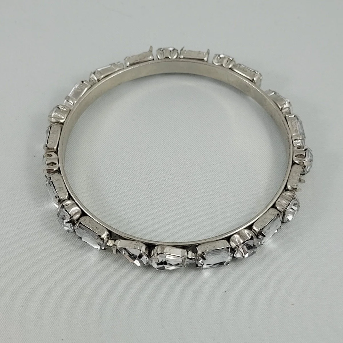 1950's - 1960's Prong Set Clear Faceted Rhinestone Medley Silver-tone .25 Inch Bangle Bracelet Top View (Copy)