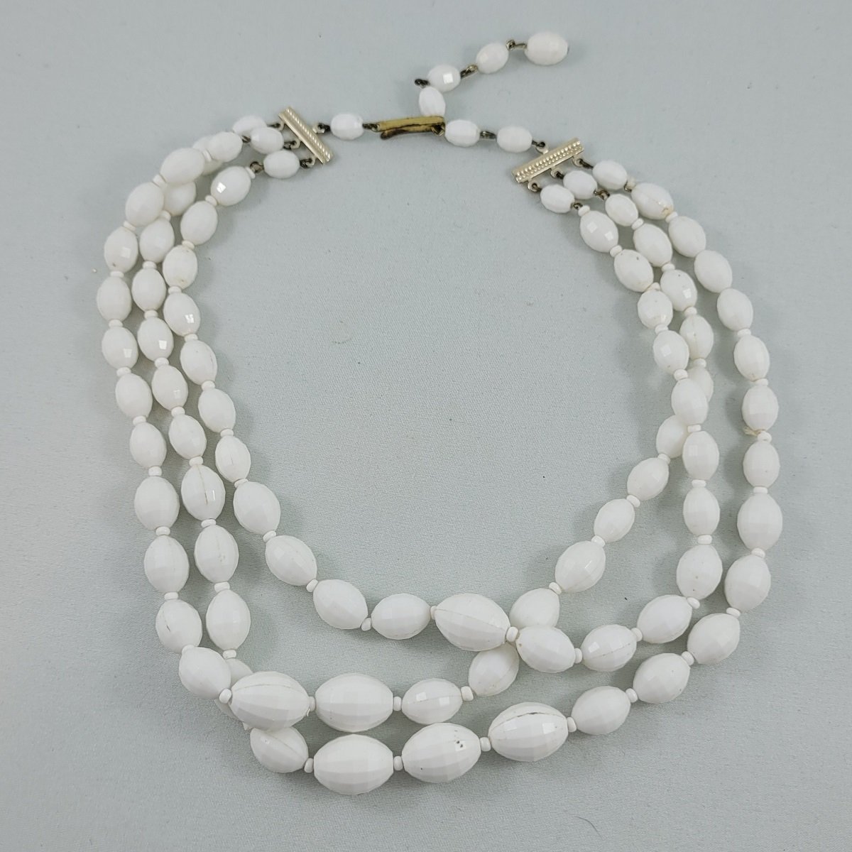 1950's Triple Strand White Sparkle Lucite Faceted Oval Bead Graduated 14-17 Inch Choker Necklace Front View