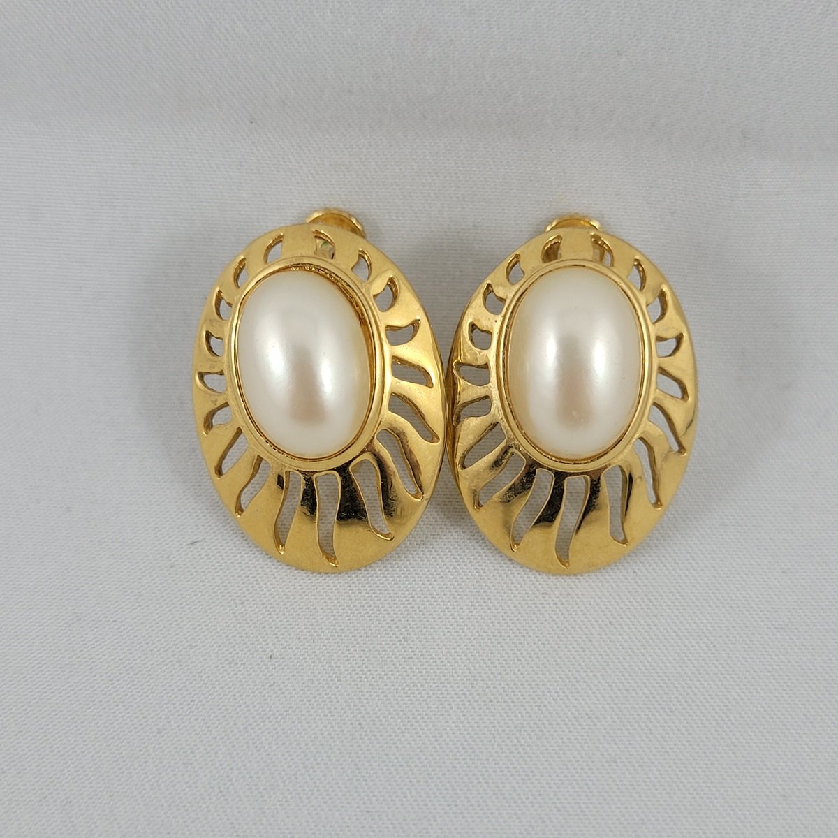 1960's Oval Faux Mabe Pearl Cabochon Openwork Golden Sun Rays Hinged Screw-Back Clip 1.125 Inch Earrings Front View