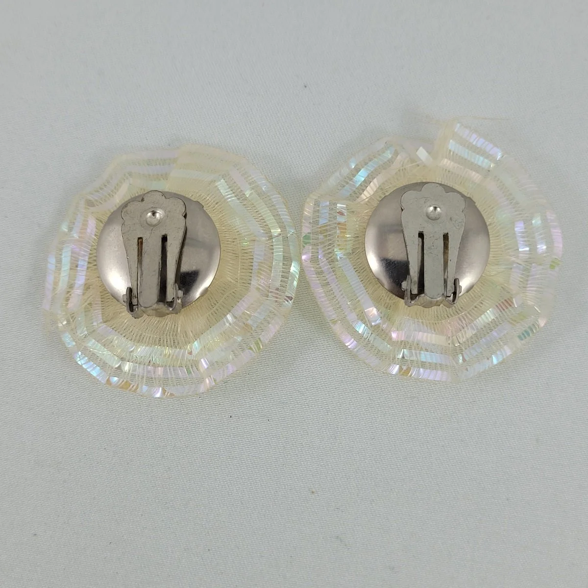 1950's White Plastic Pearl Flower Layered Iridized Soft Plastic Looped Threads 1.5 Inch Clip Earrings -1.jpg