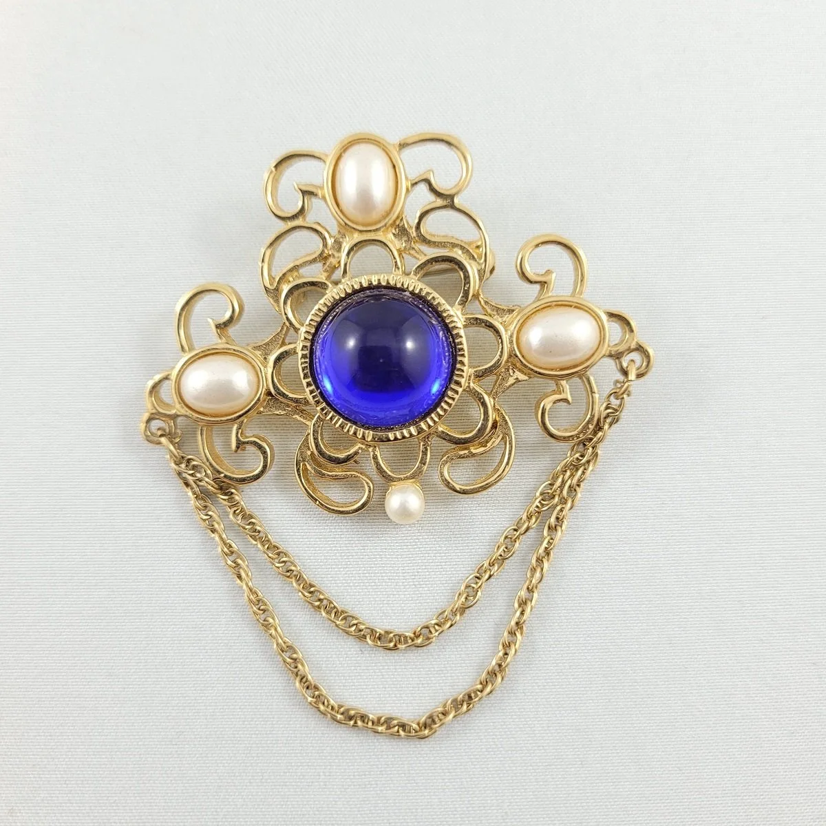 1928 Jewelry Victorian Revival Regency Cobalt Blue Gripoix-Style Resin Cabochon Mabe Pearl Double Swag Chain Chatelaine Inspired Gold-tone Brooch.jpg