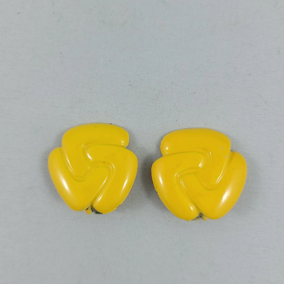 1960's Yellow Gloss Enamel Pinwheel Swirl 1.125 Inch Clip Earrings.jpg