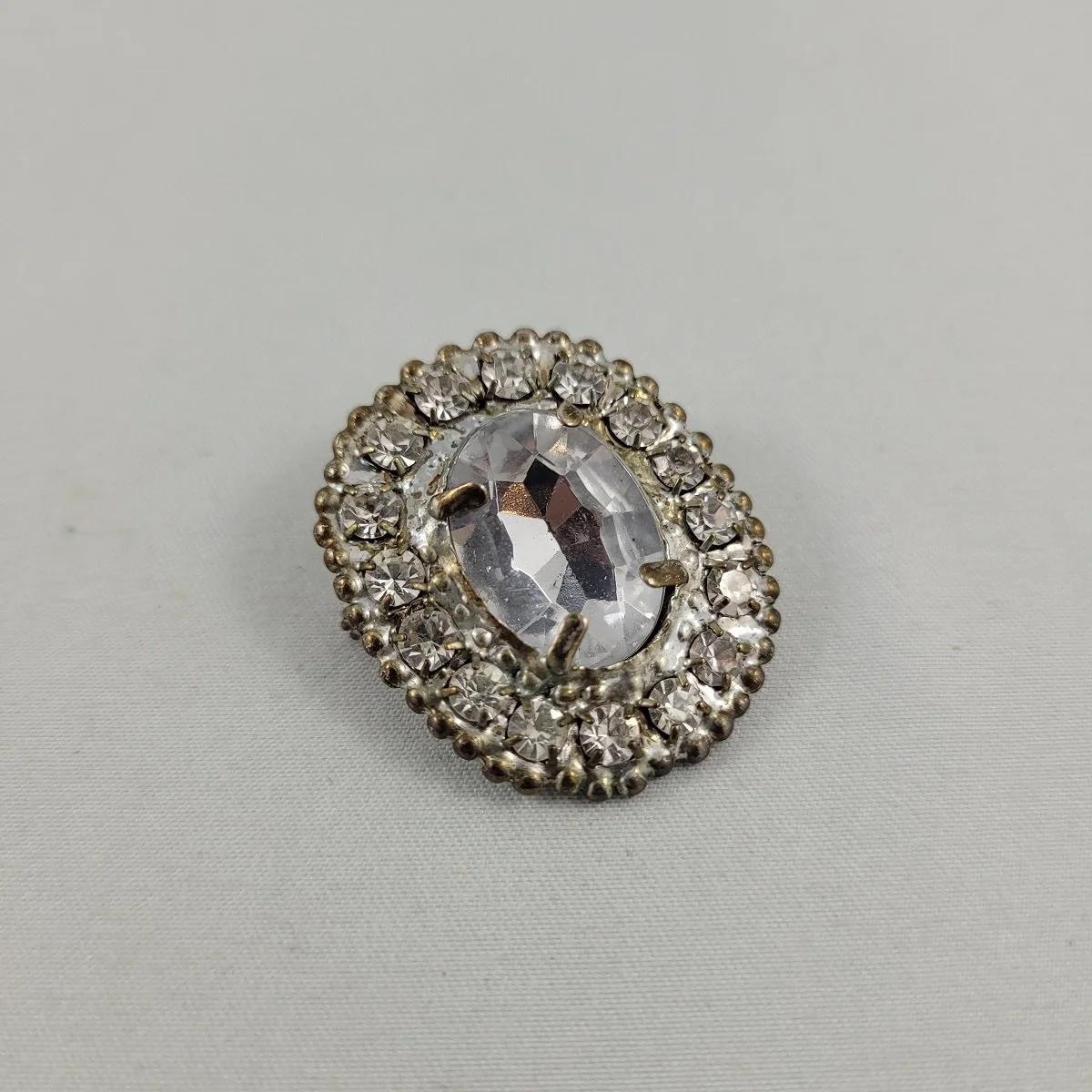 1930's Pot Metal Prong Set Clear Cabochon Chaton Pave Rhinestone 1.25 Inch Oval Brooch Side View