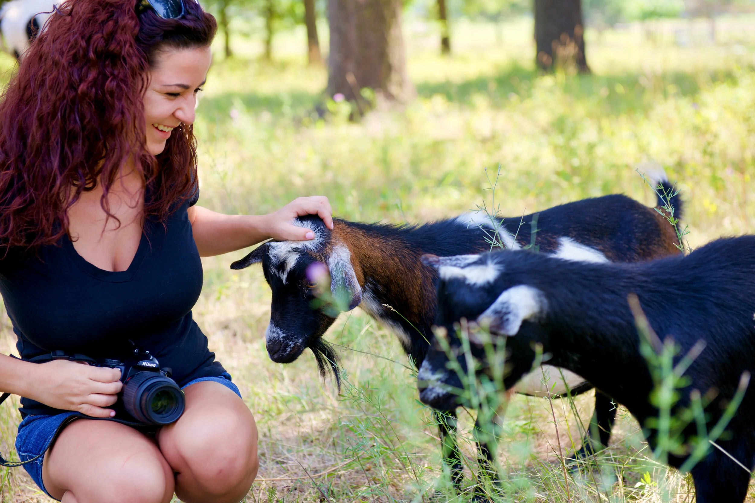 girl with baby goats.jpeg