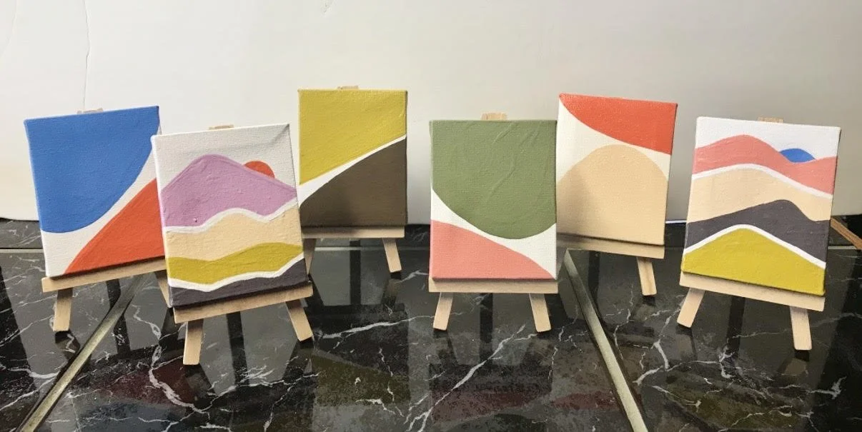 "Mini Mountains" series, created by Tamara Okun Valerine, 2020 | Tiny abstract paintings of landscapes on mini easels, featuring colorful shapes and curves.