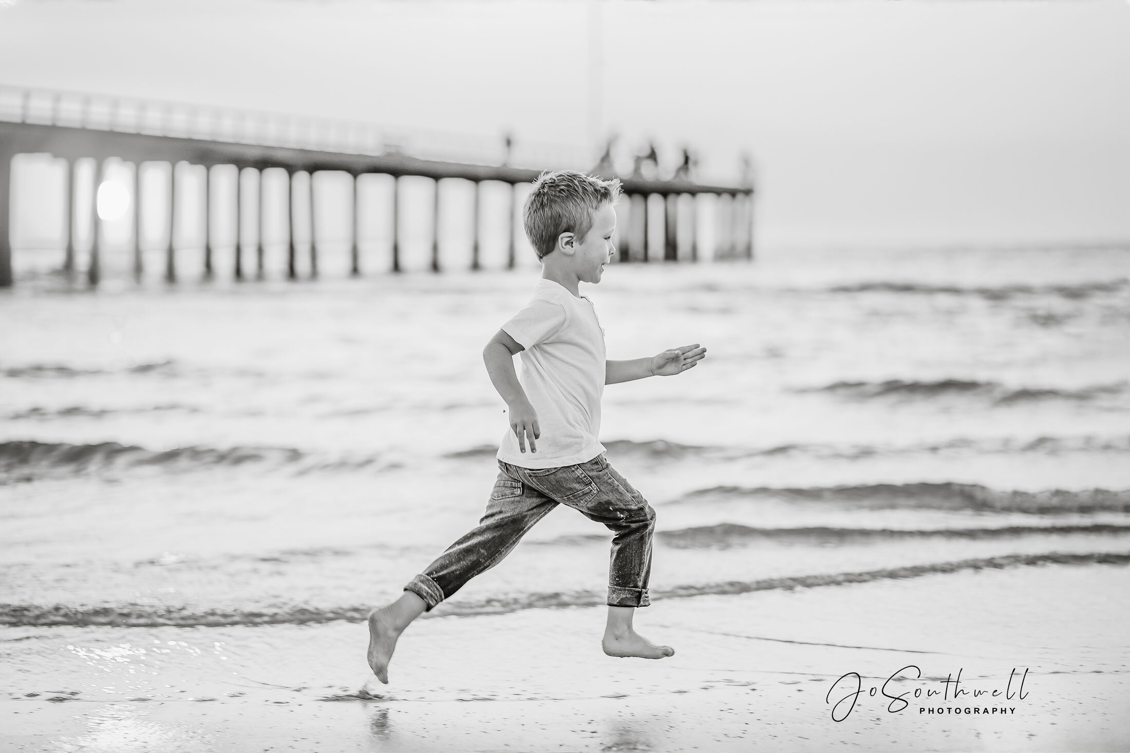 Boy running at Seaford Beach