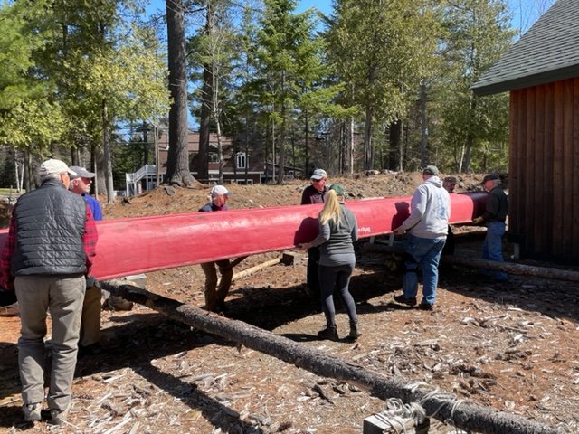 Volunteers moving canoe 2022.jpg