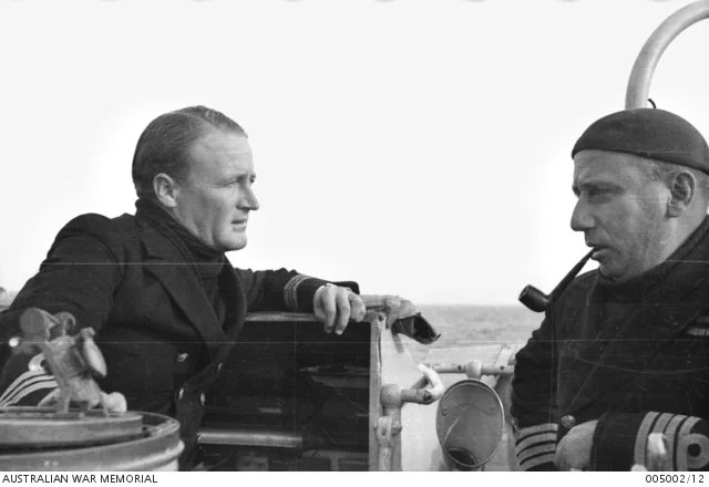  Captain Hec Waller (right) talking with Lieutenant Commander Rhodes 