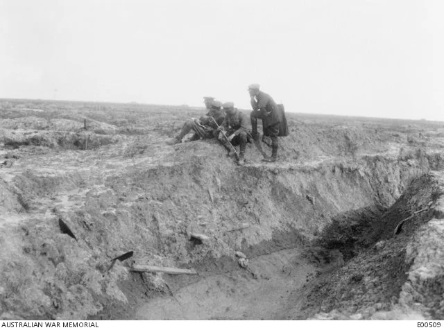  Charles Bean (left) and others survey the battlefield Pozieres in May 1917.   Courtesy AWM.  