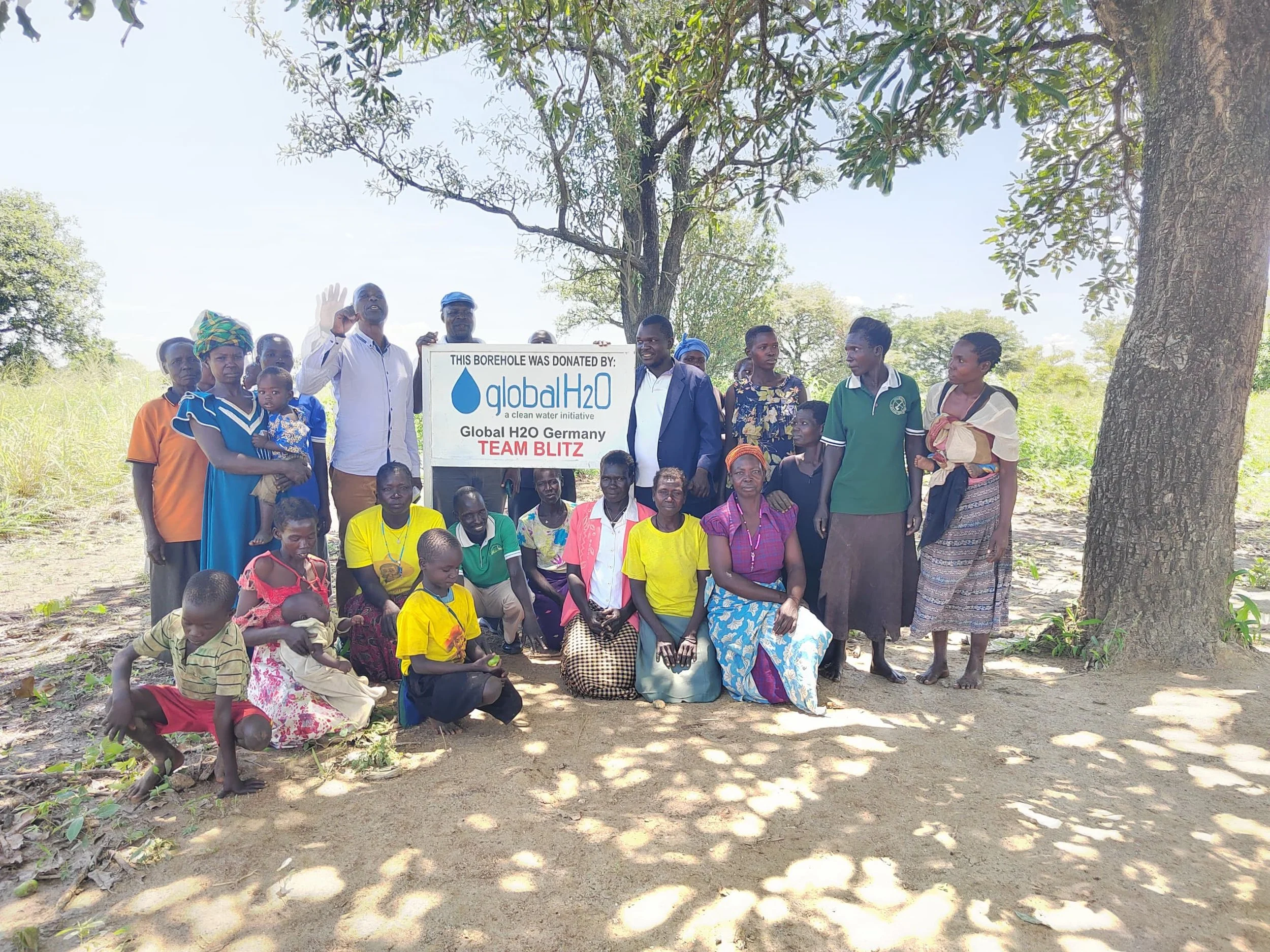 12_Group-With-Sign-Alternative.jpeg