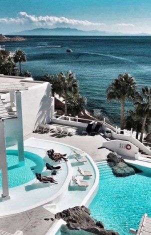 11-lounging-by-the-pool-in-grecotel-mykonos-blu-island-holidays-20355_2.jpg