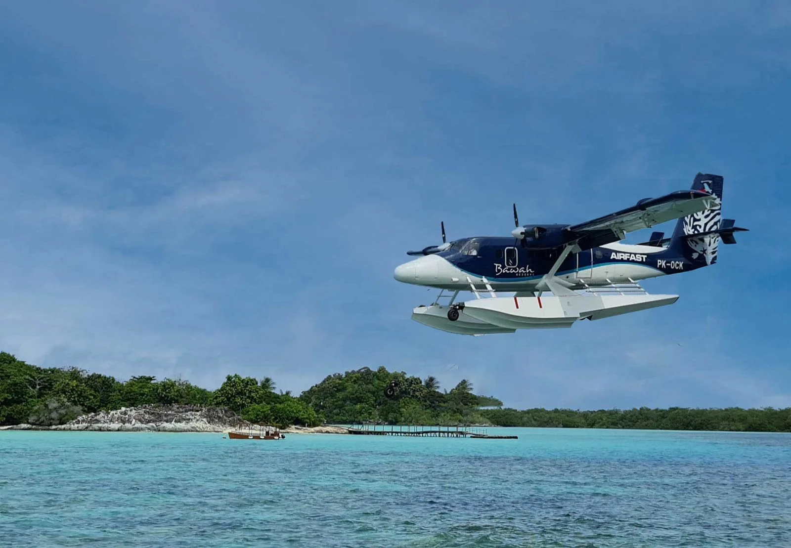 bawah-blue-seaplane-landing-on-lagoon-1.jpg