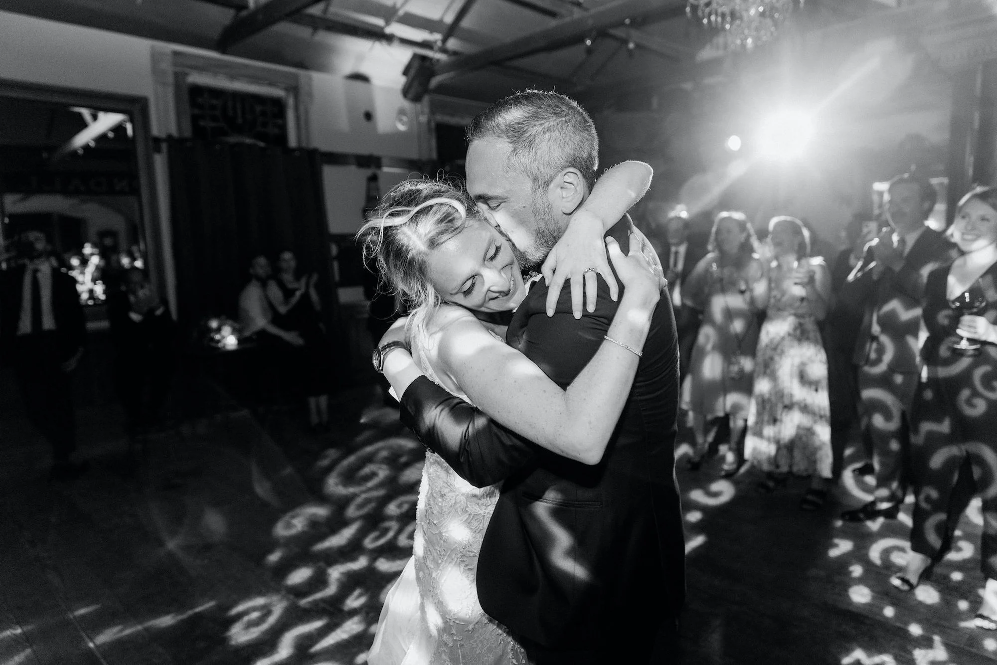 bride and groom embrace