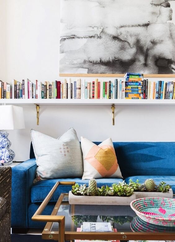 Book shelves above sofa