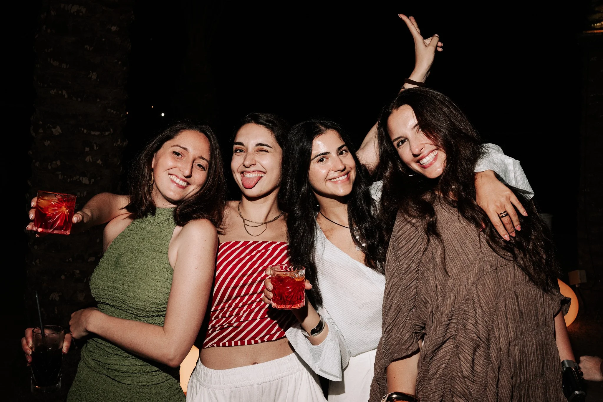 group of women posing at a staff party, event photography.