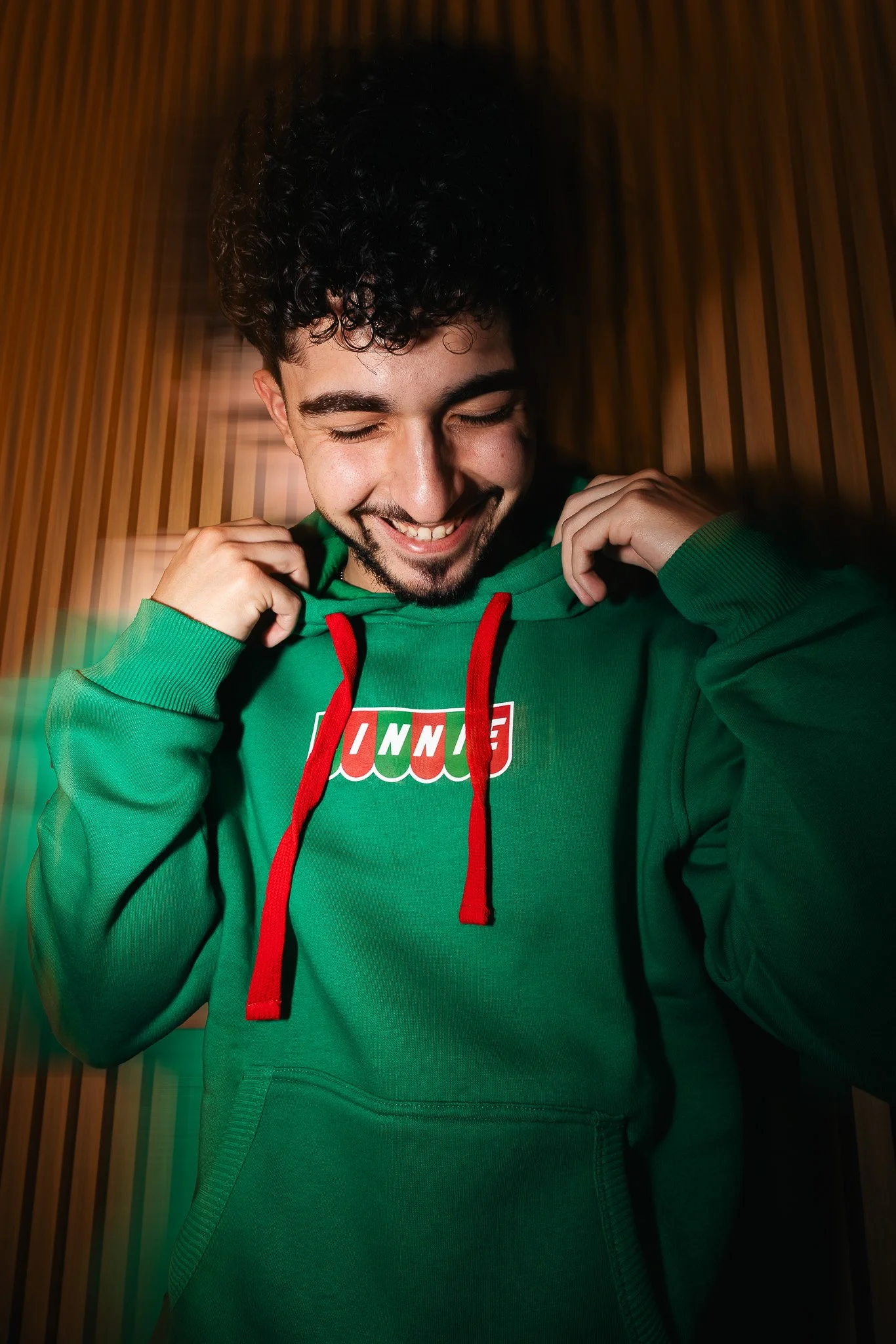 guy wearing a green kinnie hoodie