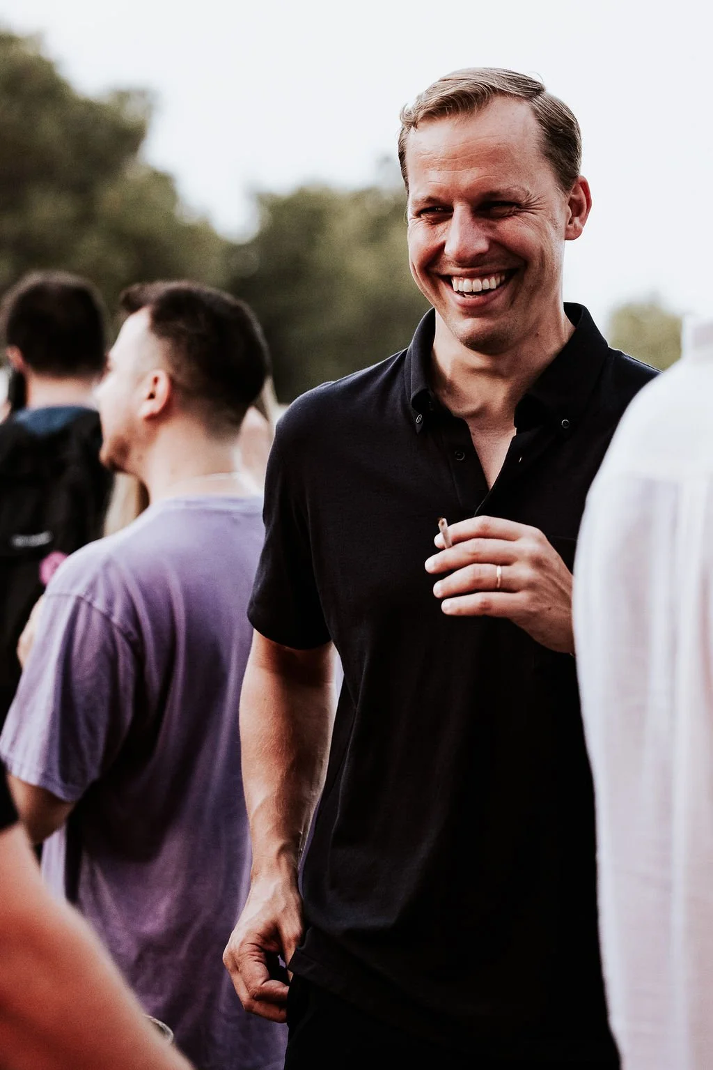 man smiling candid event photography