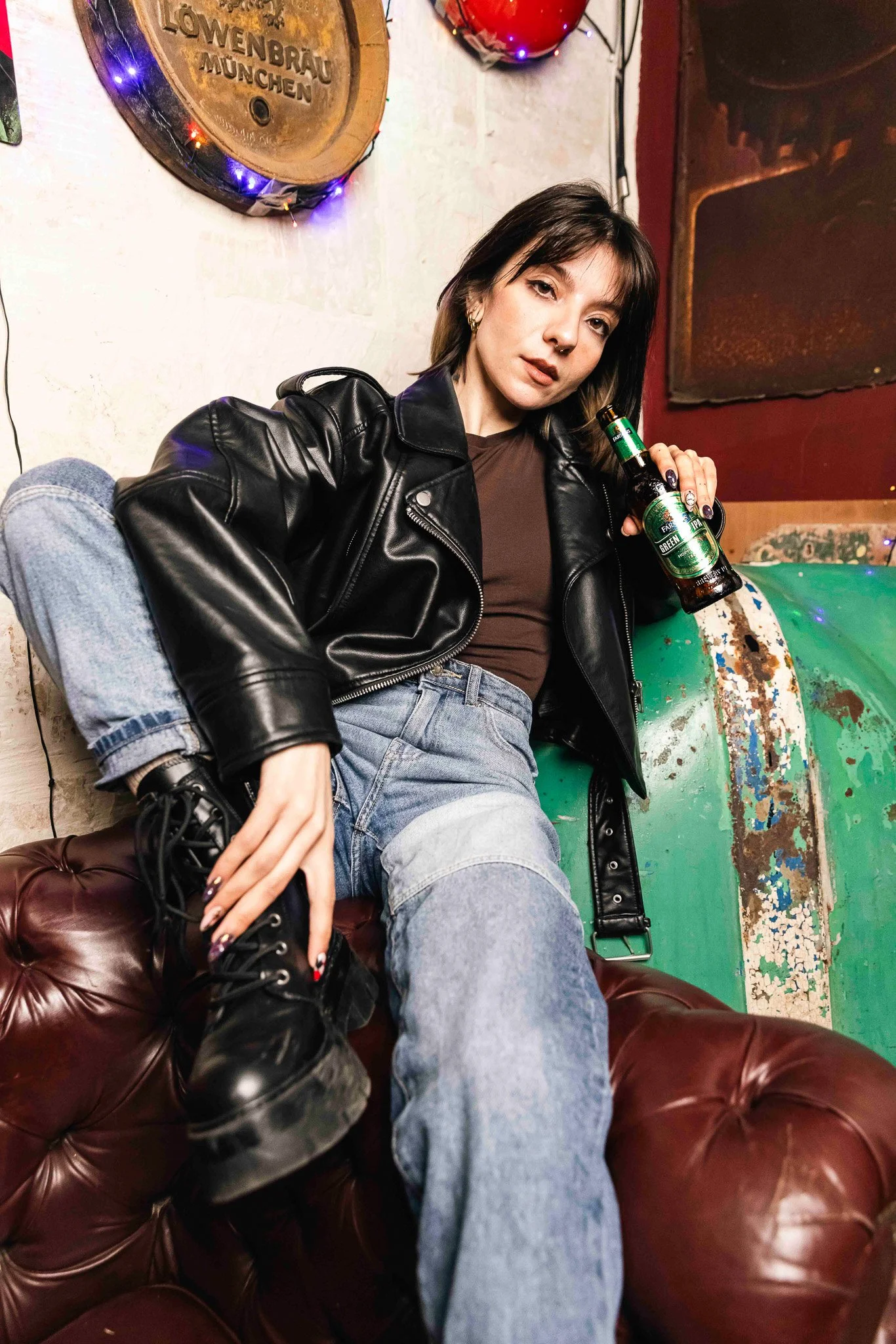alternative model, cool, holding a green hop ipa beer bottle