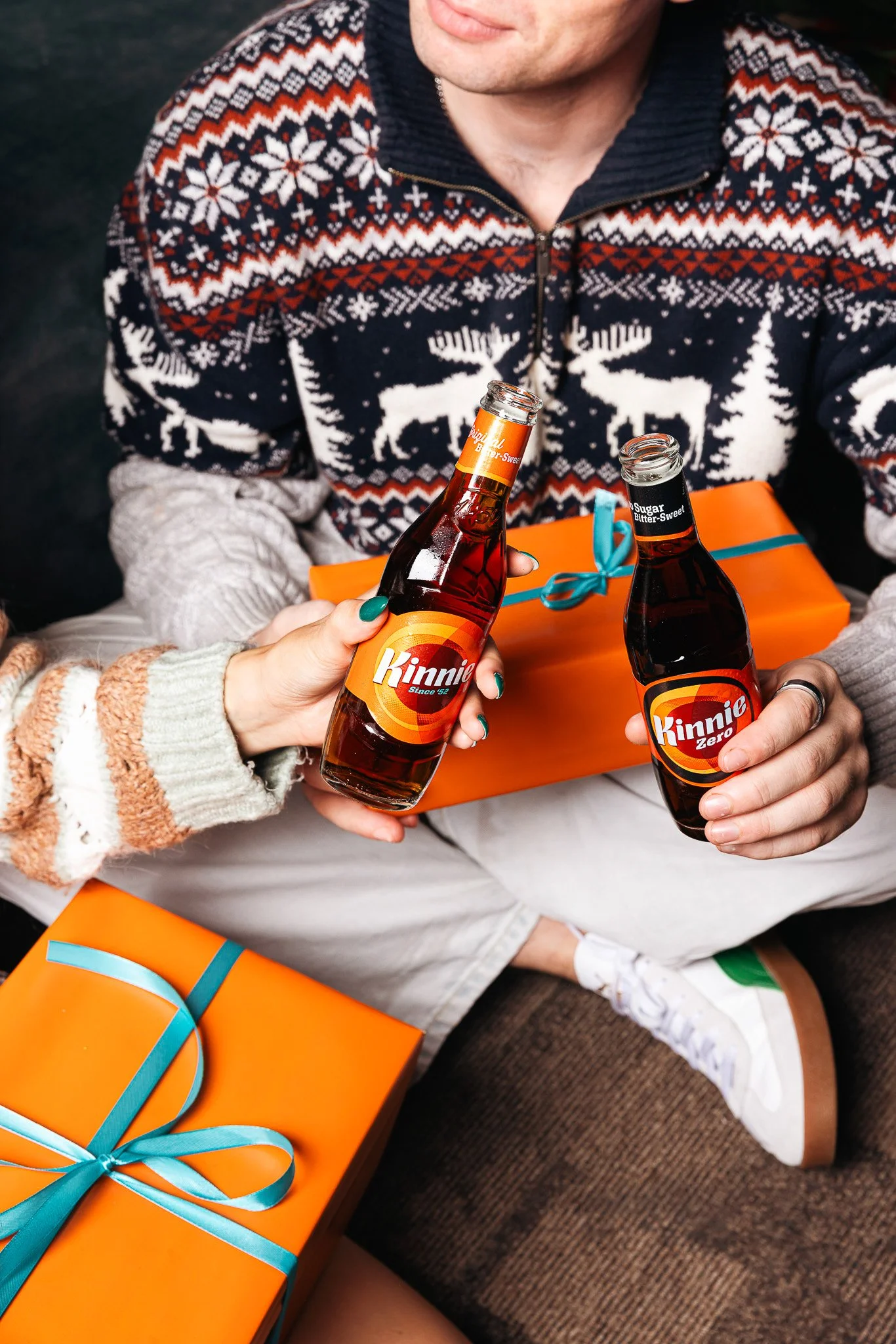 christmas time with Kinnie bottles, orange and teal christmas presents, winter shoot