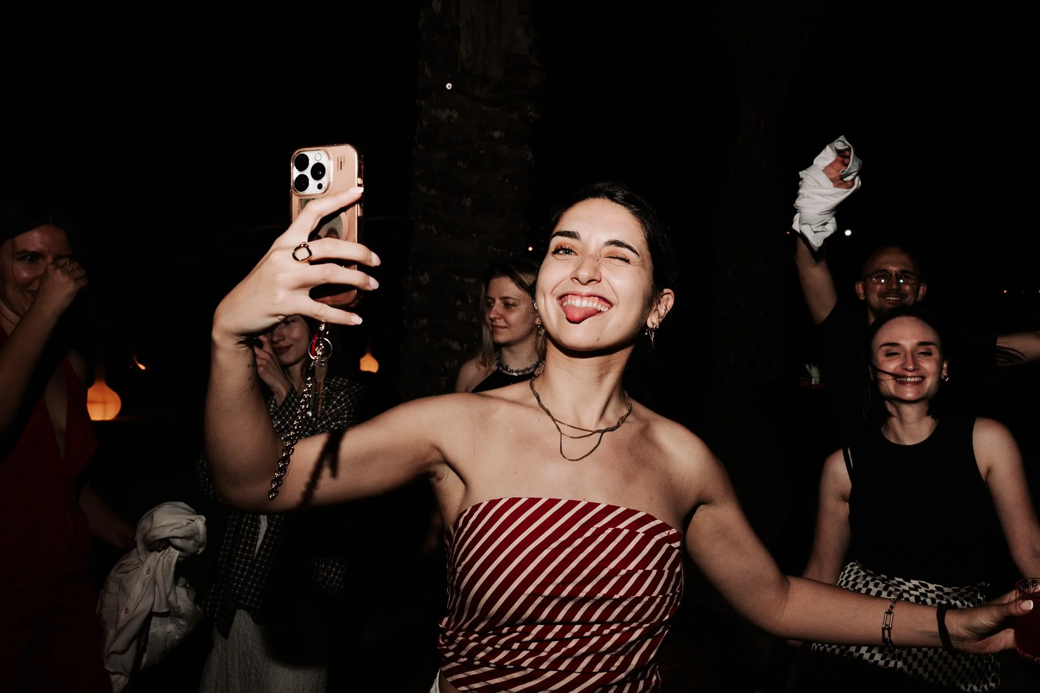 woman striking a fun pose, event photography.
