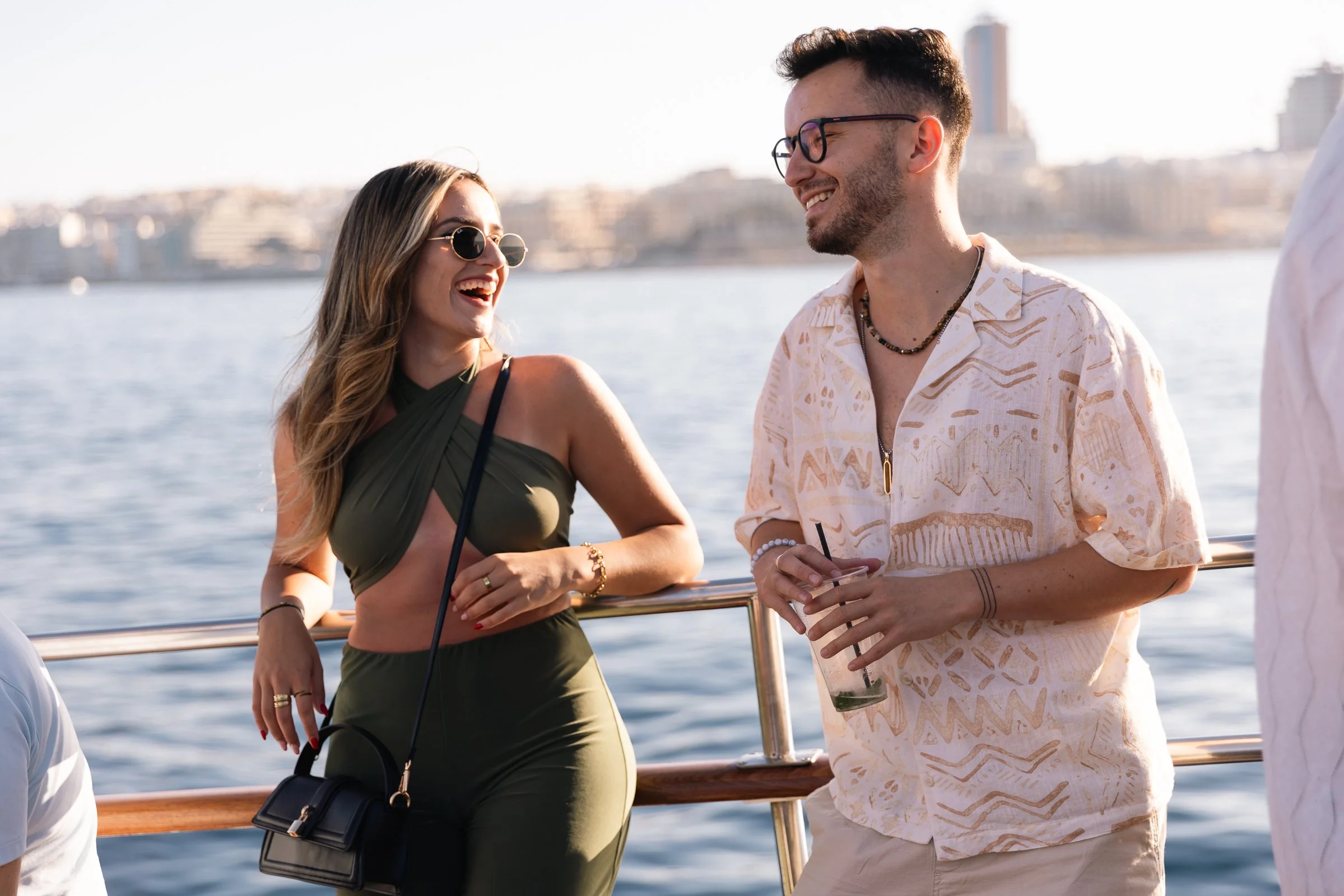 two people on a boat laughing, event photography.