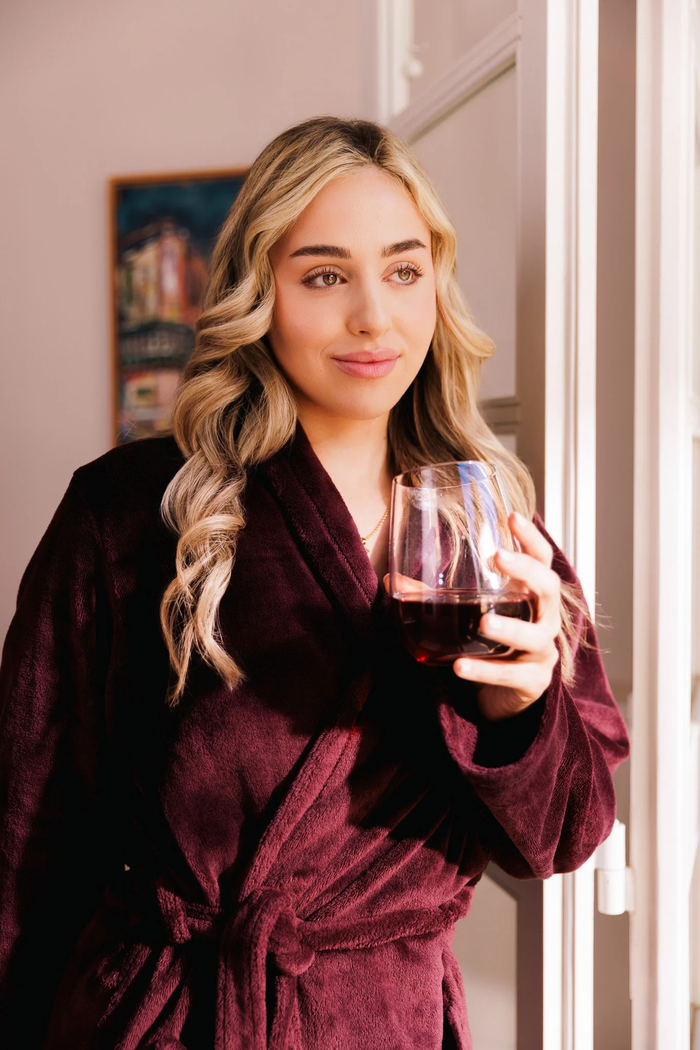 woman having a glass of vival juice