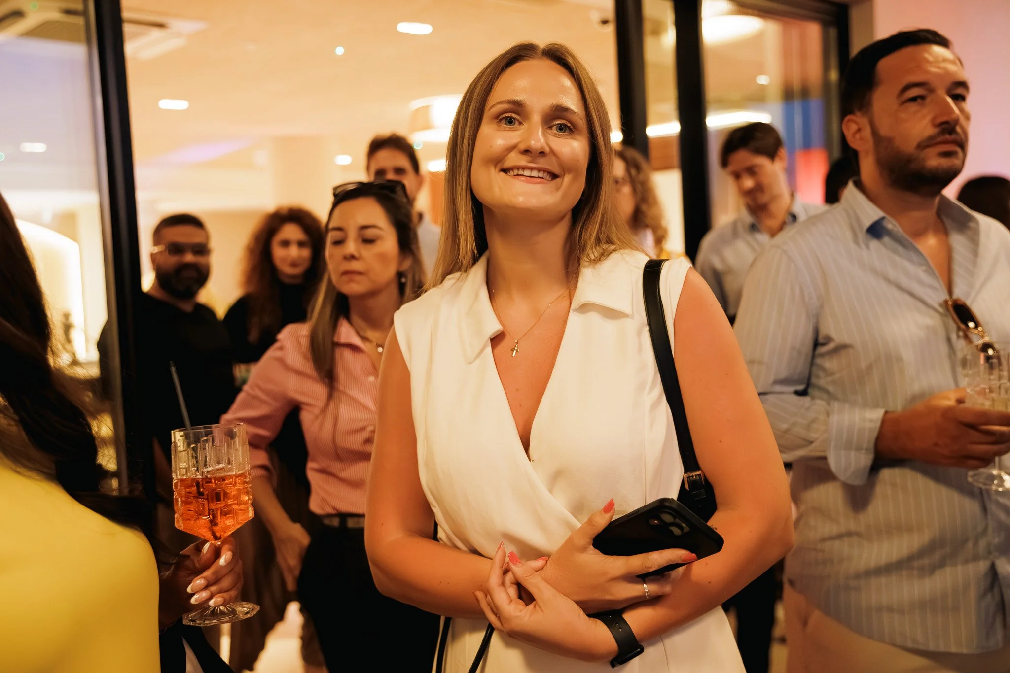 woman smiling at an igaming event, photography.