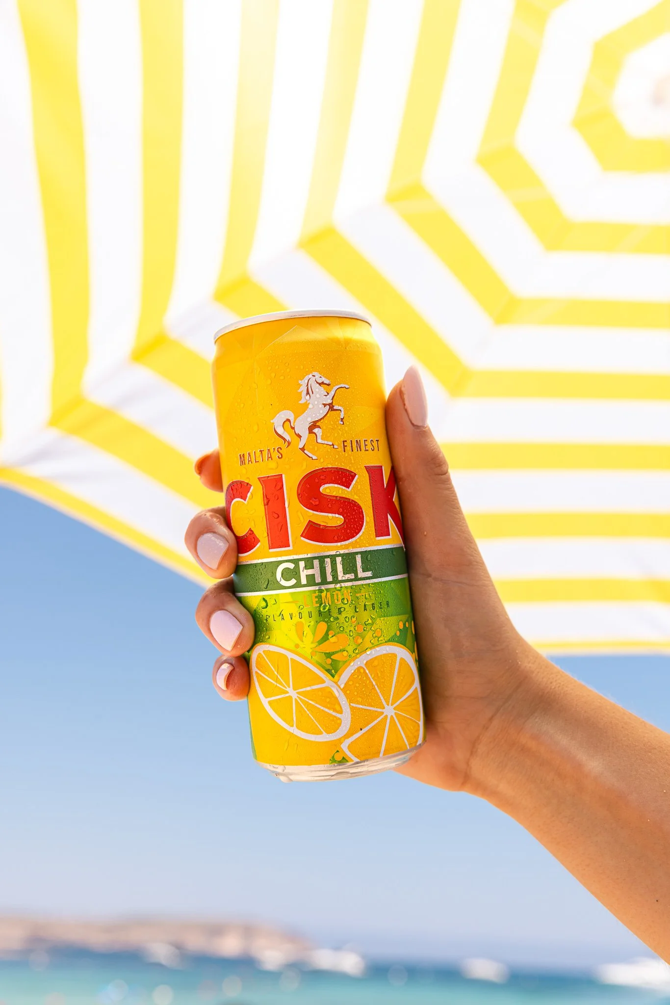 cisk chill lemon beer can outdoors, summer product shoot