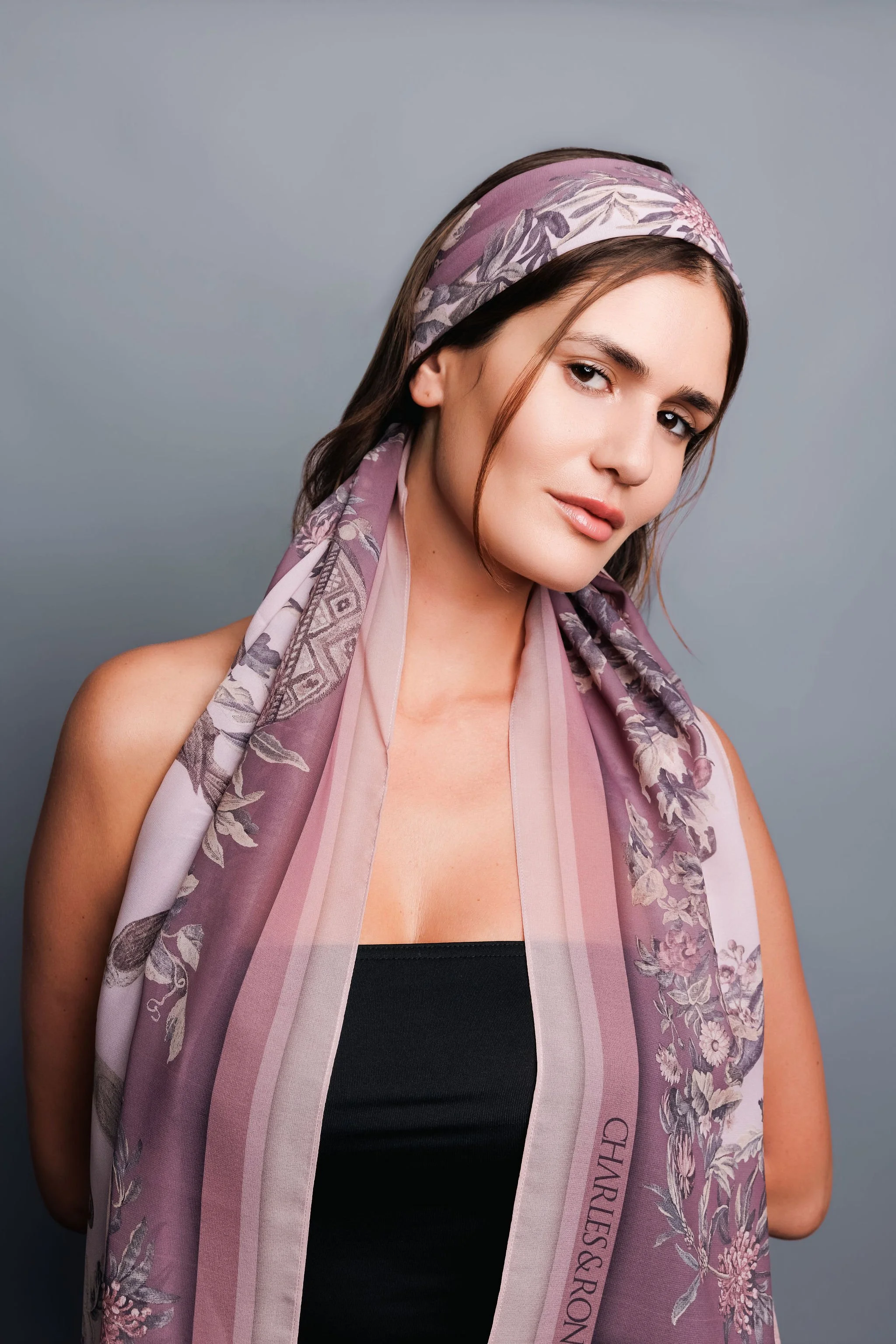 model wearing a charles and ron heritage malta scarf on her head