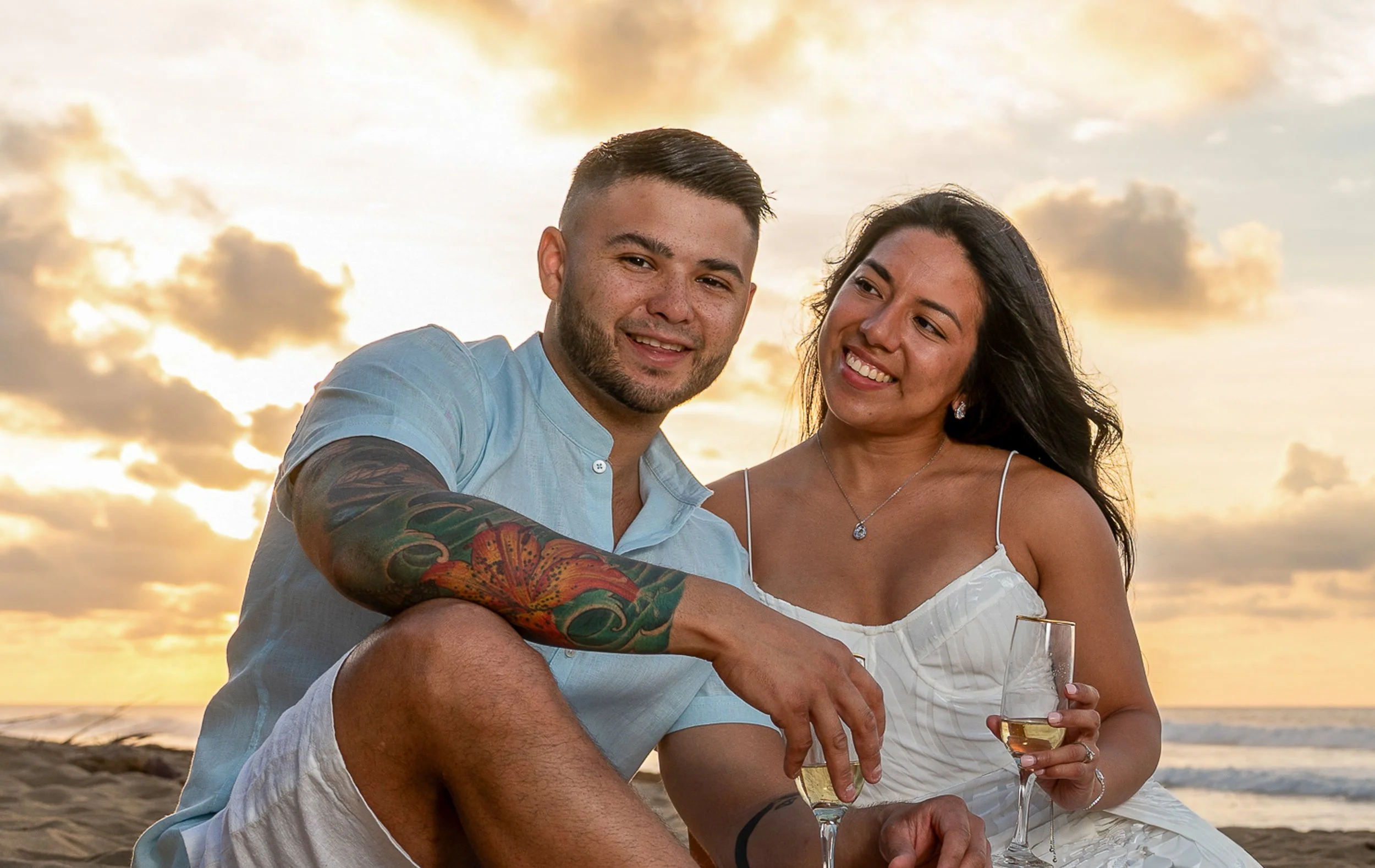 Couple relaxing together during a sunset photography session on the coast of Puerto Rico.