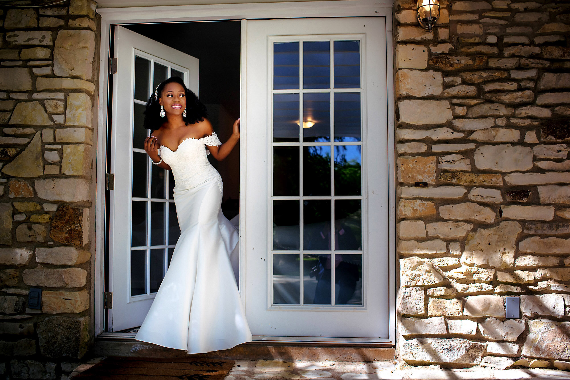 11-Austin-wedding-photographer-Jide-Alakija-bride walking out of the suite.jpg.JPG