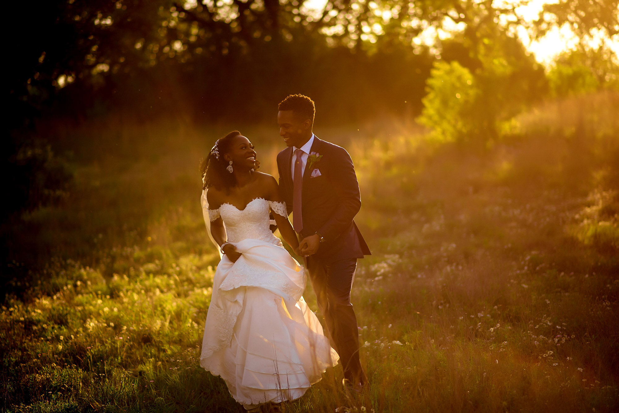 37-Austin-wedding-photographer-Jide-Alakija-couple walking in the sunset.jpg.JPG