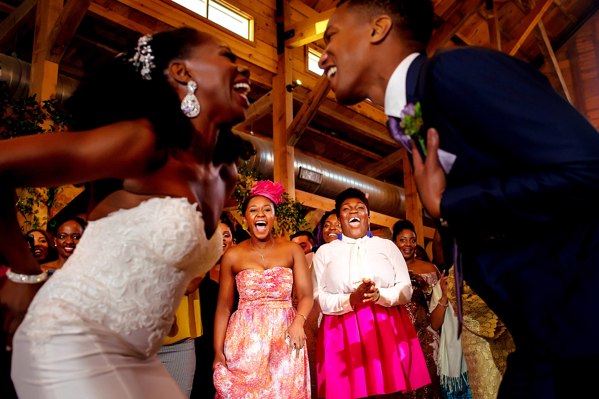 42-Austin-wedding-photographer-Jide-Alakija-couple dancing while theres a reaction from guests.jpg.JPG