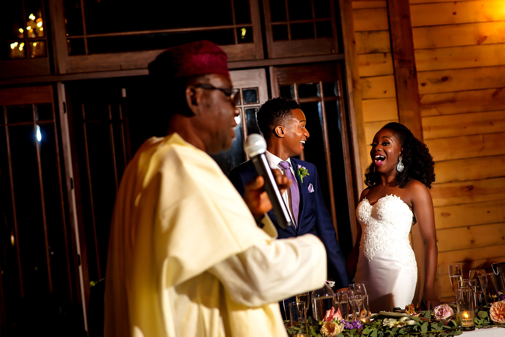 48-Austin-wedding-photographer-Jide-Alakija-reaction of bride and groom to fathers speech.jpg.JPG