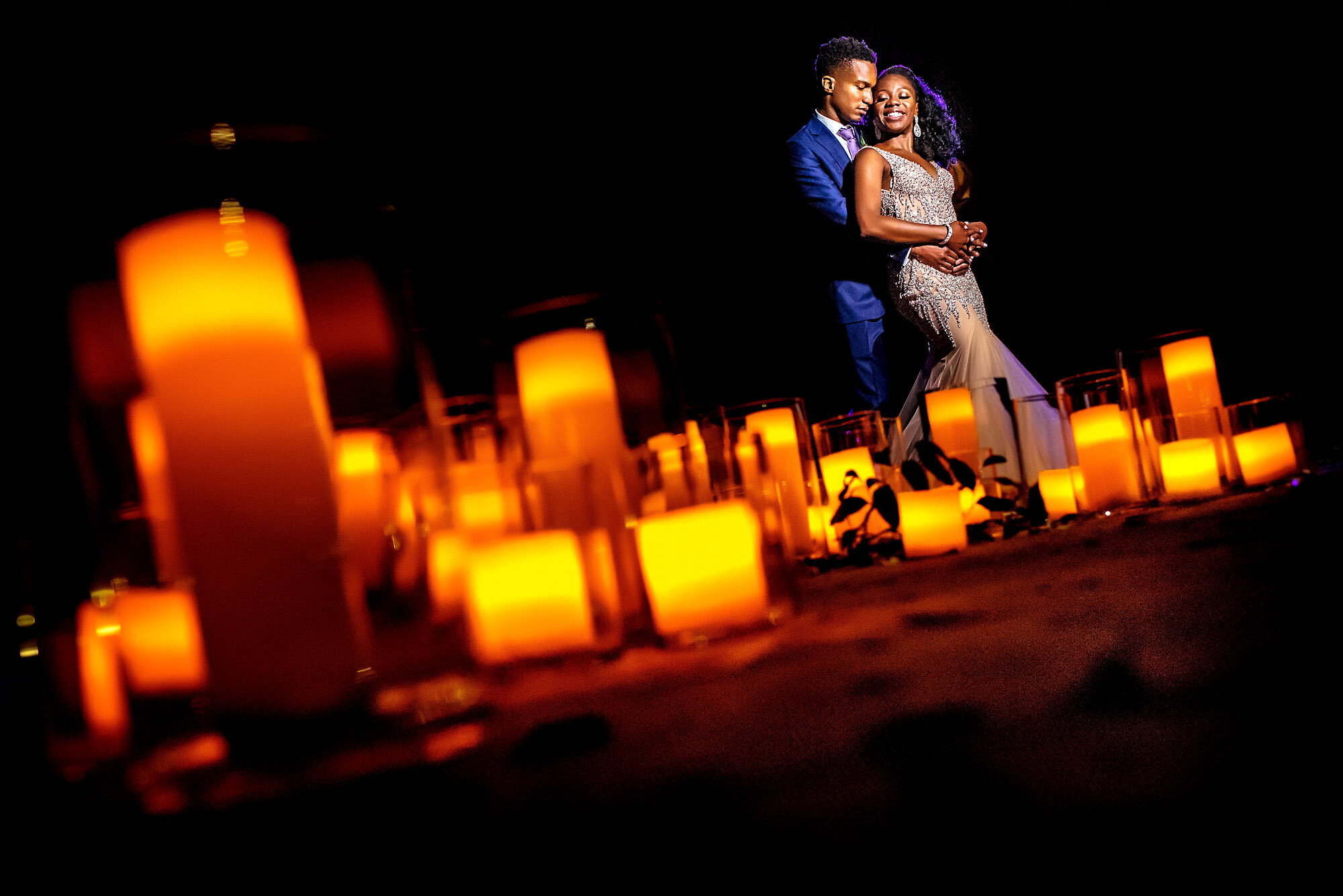 60-Austin-wedding-photographer-Jide-Alakija-couples portrait with candles in the foreground.jpg.JPG
