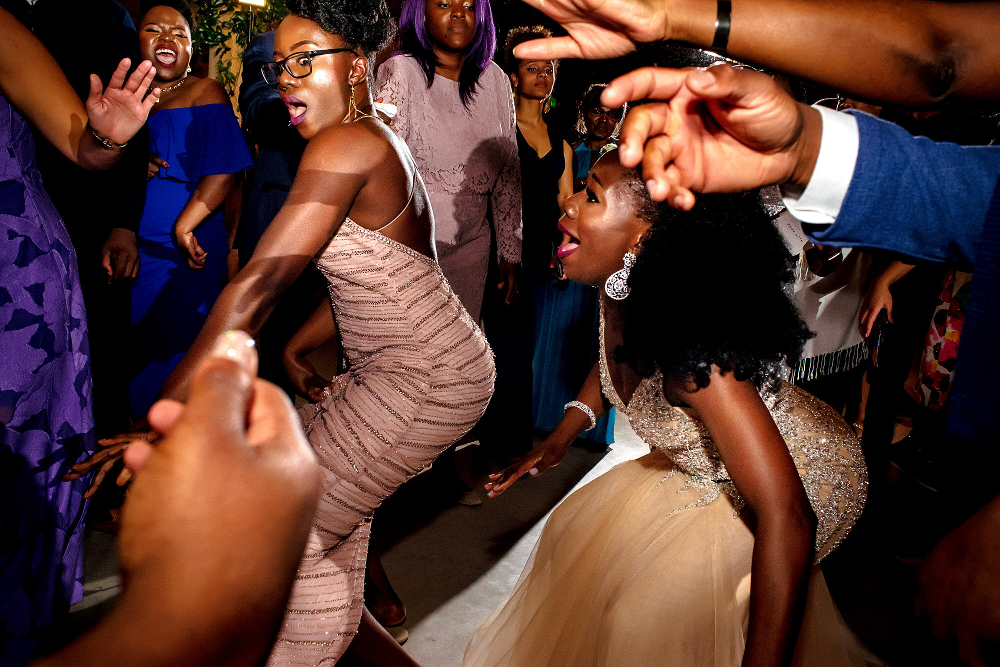 67-Austin-wedding-photographer-Jide-Alakija-bride and sister with strong reactions on the dancefloor.jpg.JPG